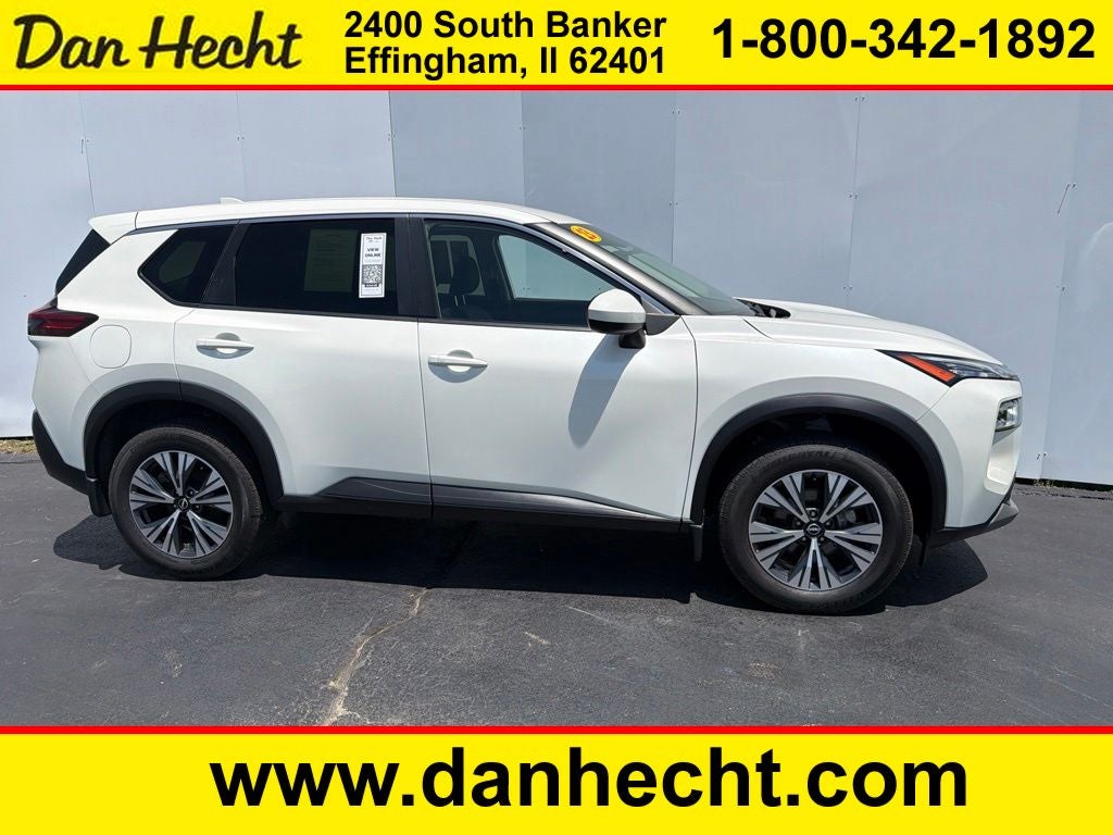 2023 Nissan Rogue SV in Pearl White — front three-quarter view